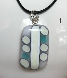 Three different robin's egg blue and French vanilla reaction pendants