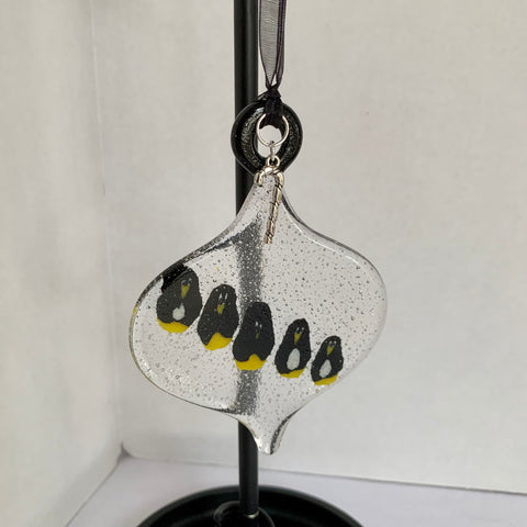 Traditionally shaped ornaments with penguins.