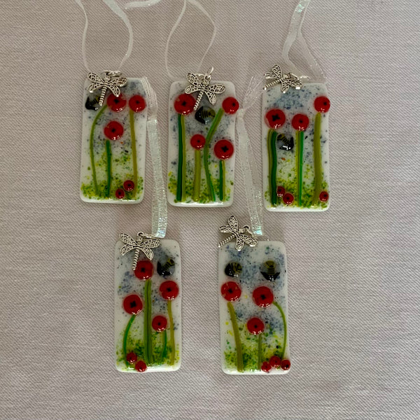 Ornaments with flowers and bees, with a dragonfly charm.