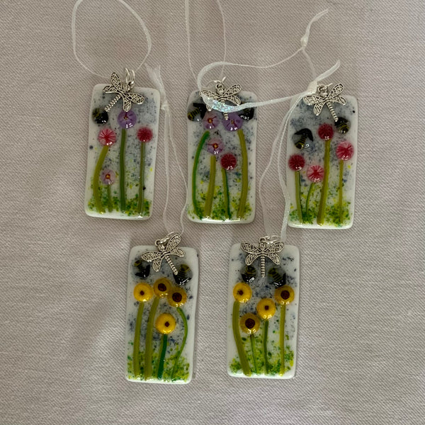 Ornaments with flowers and bees, with a dragonfly charm.